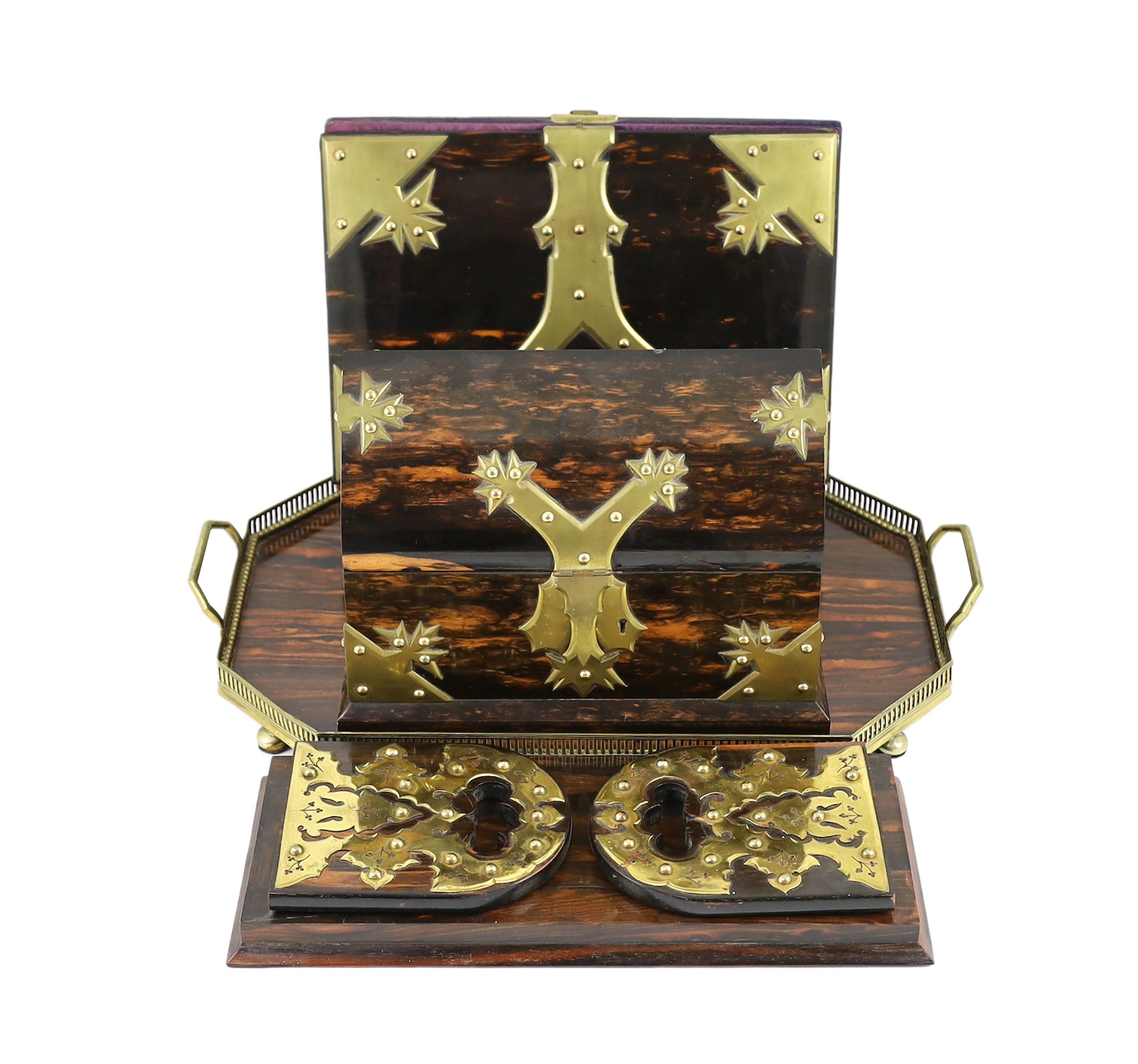 A Victorian brass mounted coromandel wood stationery casket with matching blotter, a similar book rack and gallery tray, 26cm